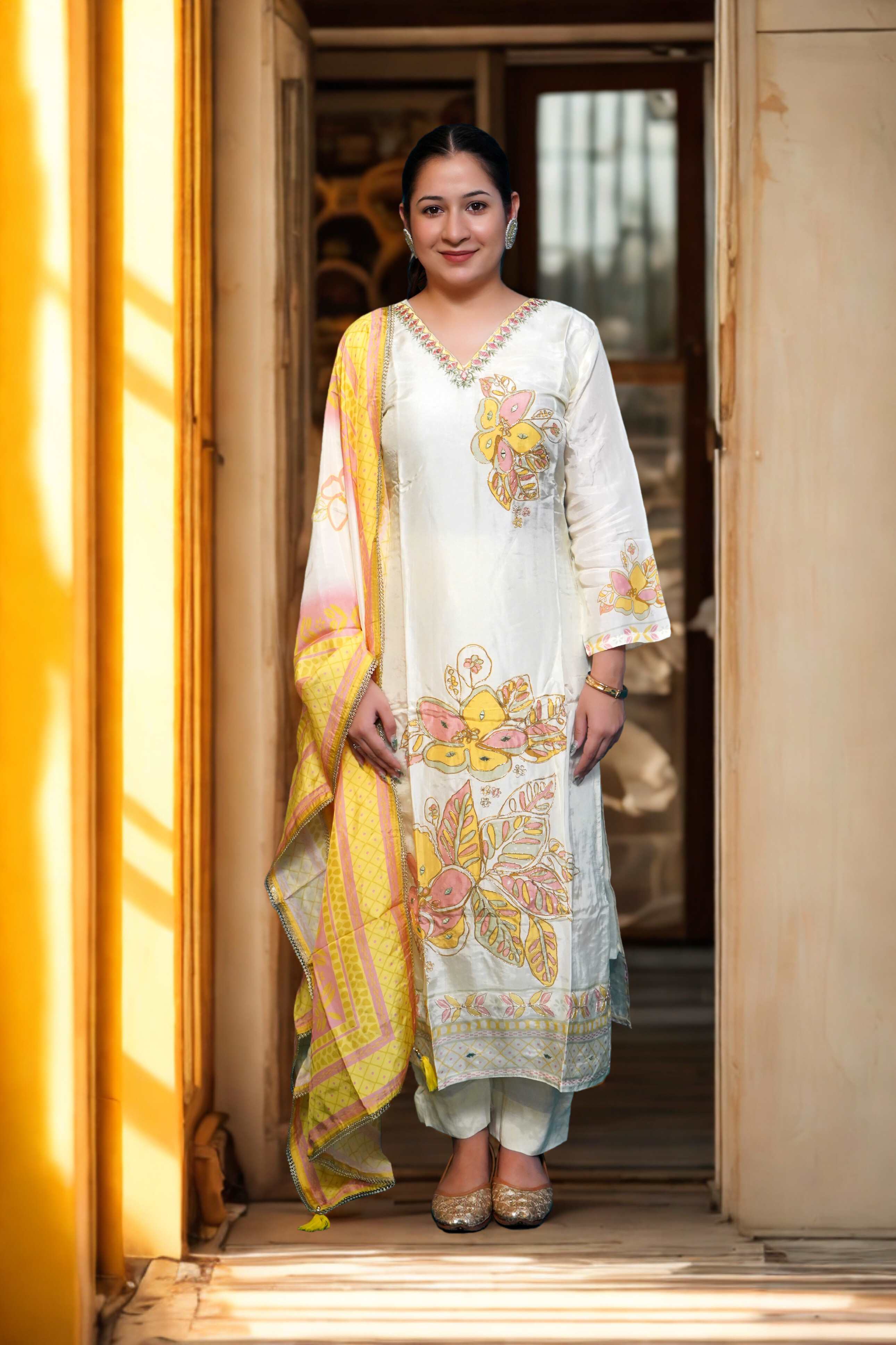 Semi stitch suit with golden zari work