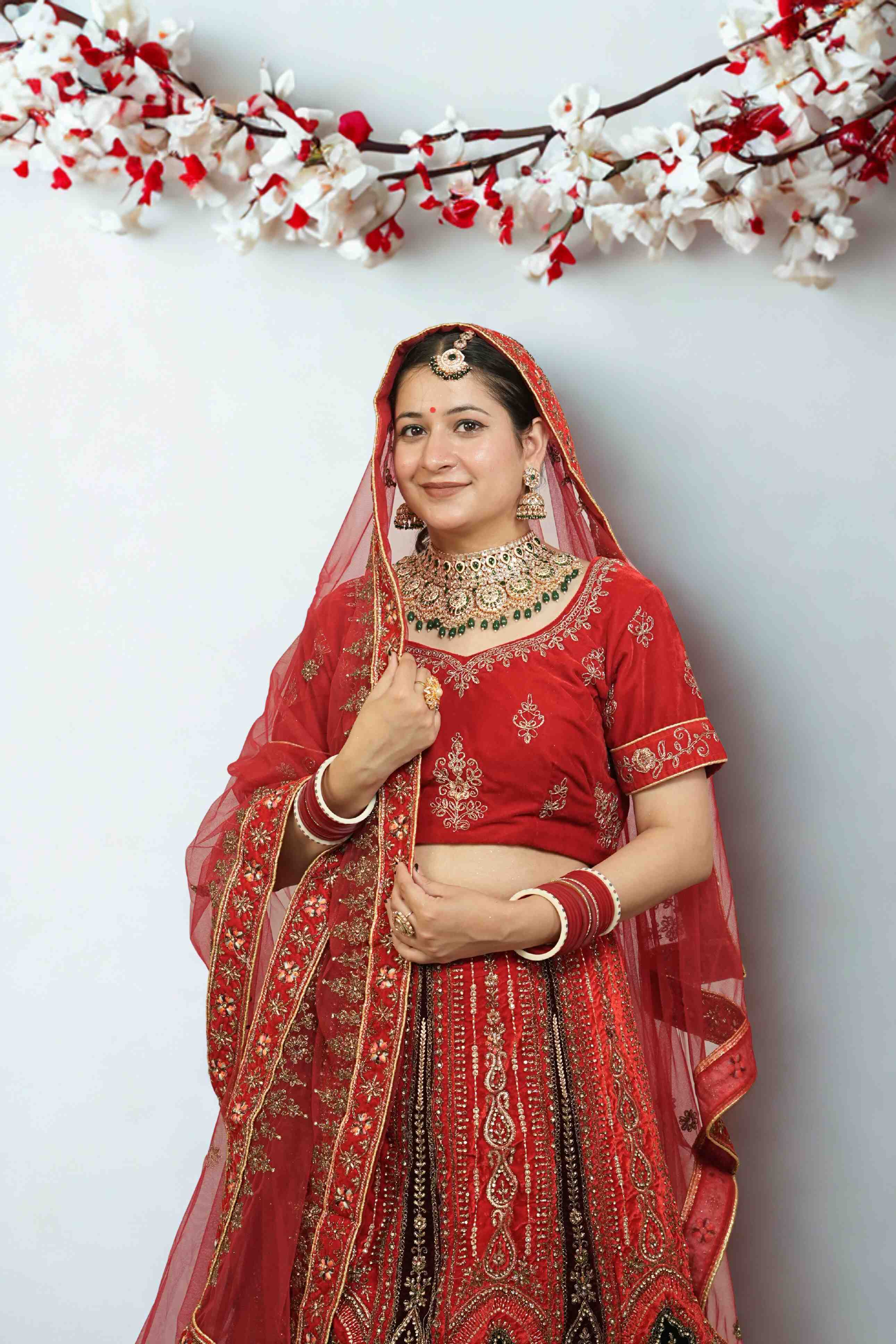 Scarlet Velvet Bridal Lehenga with Antique Zari and Green Resham Detailing